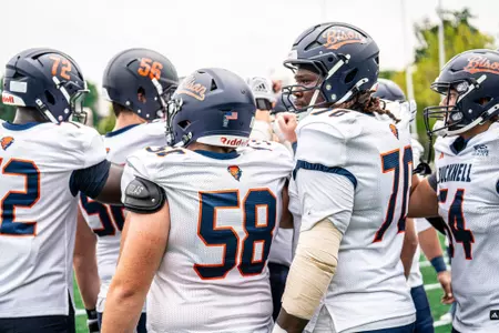 Football Offensive Line Huddle at Marist