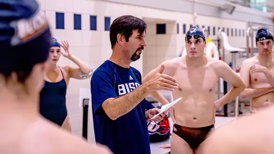 Dan Schinnerer talks to the team at practice