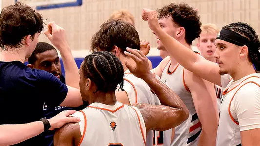 Men's Basketball Group Huddle