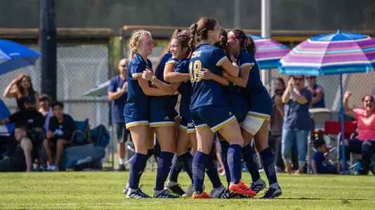 CBU women's soccer celebrates a goal in CBU's 3-0 victory over NM State.