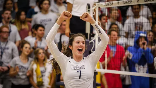 Lauren Hackett celebrates after scoring a point for the 2018 volleyball team