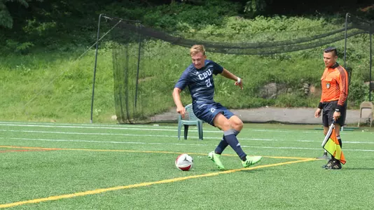 Linus Mansson keeps the ball in play in CBU's game at Manhattan College.