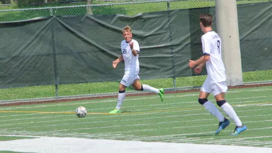 Linus Mansson passes a ball off to his teammate at Saint Peter's.