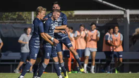 Niklas Haakenstad, Sebastian Wiesbock and George Ionascu celebrate a goal in CBU men's soccer's 2-1 victory over Seattle U.