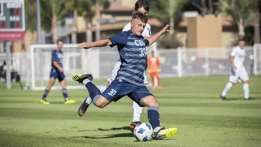 Matthias Binder fires off a long-range shot for CBU men's soccer.
