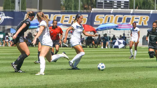 Miranda Martinez fends off a defender.