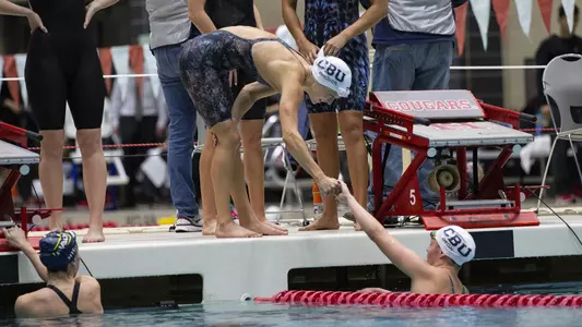 Isabella Rhodes and Mackenzie Degn relay