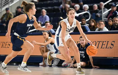 Klaman drives on Lumberjack defender