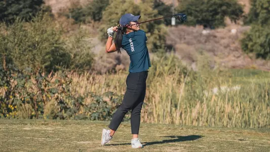 Lisa teeing off