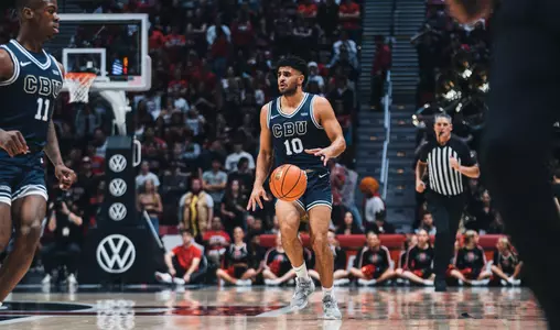 Moussa dribbling up court