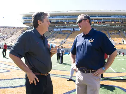 WSU coach Mike Leach and Cal coach Sonny Dykes talk before Saturday's game.