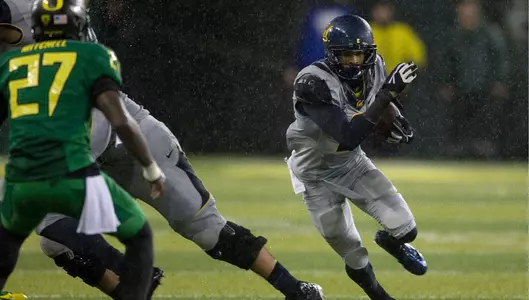 The Bears fell at No. 2 Oregon, 55-16, in a driving rain storm.