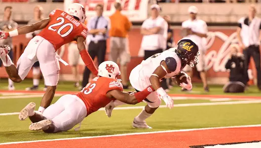 Tre Watson enters the end zone at the end of a four-yard run.