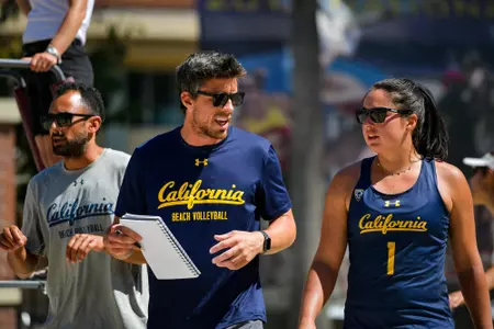 Assistant Coach Derek Olson and Mia Merino discuss during Cal's loss to Arizona State