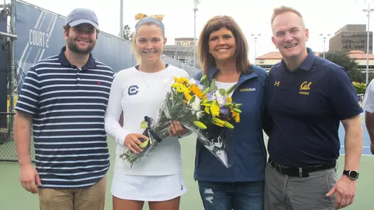 Olivia Hauger with brother Chris and parents on Senior Day