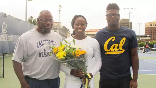 Maria Smith with her father and brother on Senior Day