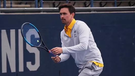 Associate head coach Tyler Browne preps the Bears before the 2019 match vs. Arizona State