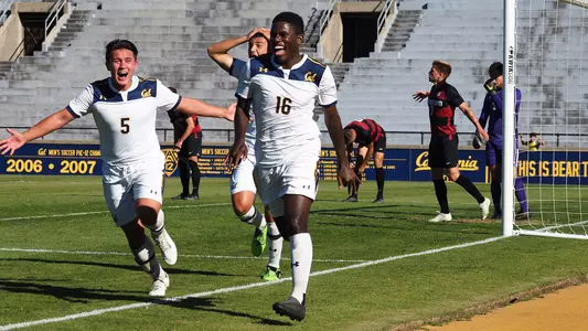 Christopher Grey celebrates his goal with Dylan Penn and teammates
