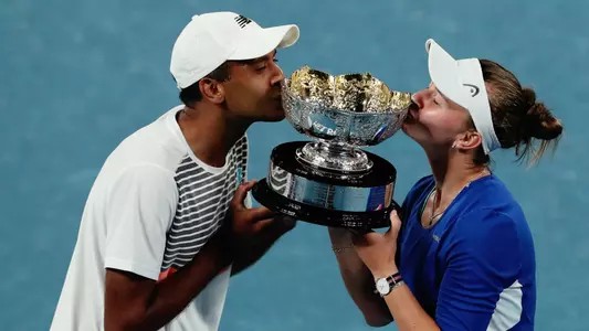Rajeev Ram and Barbora Krejcikova with the 2021 Australian Open mixed doubles trophy