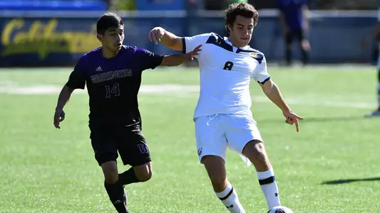 Cal's Juan Martinez fends off UW's Christian Soto at Witter.