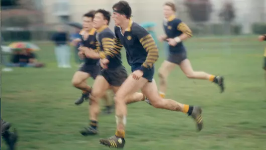 Mark Bingham running during rugby match