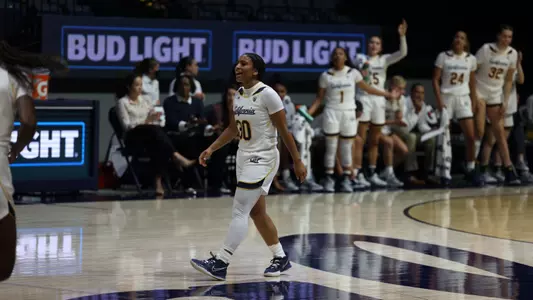 Jayda Curry celebrates after a three-pointer