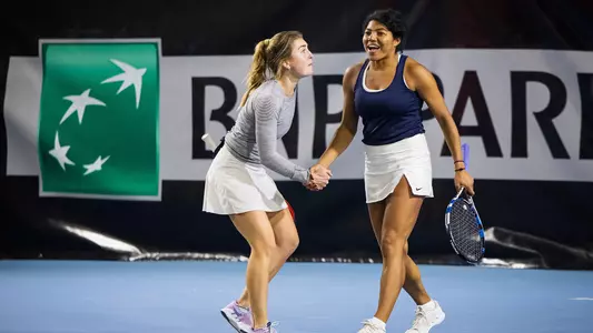 Cal's Haley Giavara (right) and UNC's Fiona Crawley (left) in their doubles win in the Master'U BNP Paribas final.
