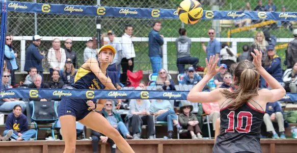 Alex Young spikes the ball