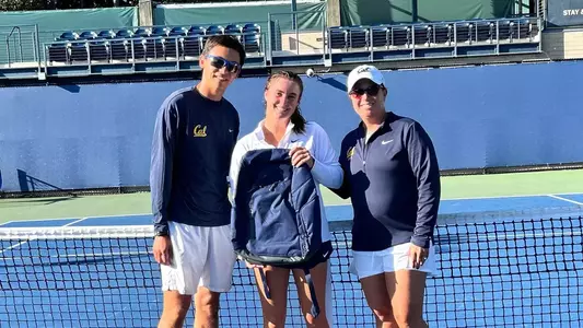 Cal coaches pose with Sophie Hernandez after the latter won the top singles title at the Cal Fall Invite
