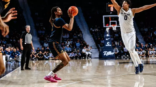 Chris Bell puts up one of his seven 3-pointers made at K-State