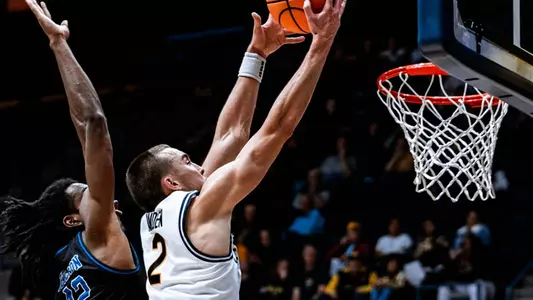 John Camden rises up for a shot vs. Presbyterian at Haas Pavilion