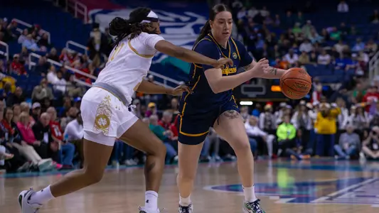 Cal WBB: Marta Suarez drives against Notre Dame