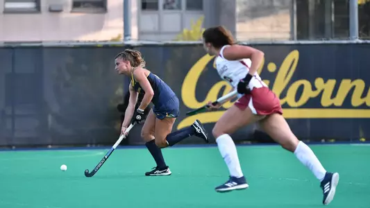 Liz Klompmaker dribbling against Harvard
