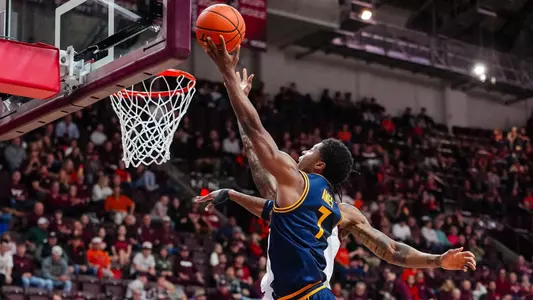 Dai Dai Ames goes up for a layup at Virginia Tech