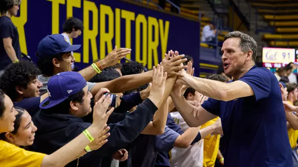 Mark Madsen gives fives to fans at Haas Pavilion