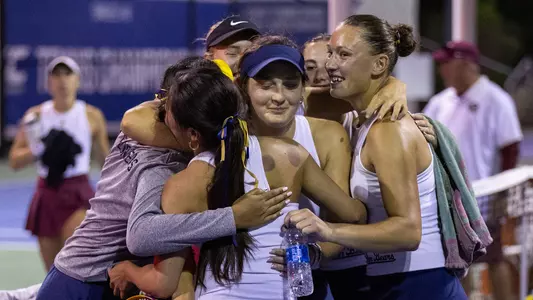 Bears celebrate with Berta Passola Folch after she clinched the ACC third-round win over Florida State.