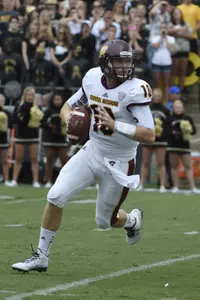 Cooper Rush rolls out in the first half at Ross Ade Stadium.