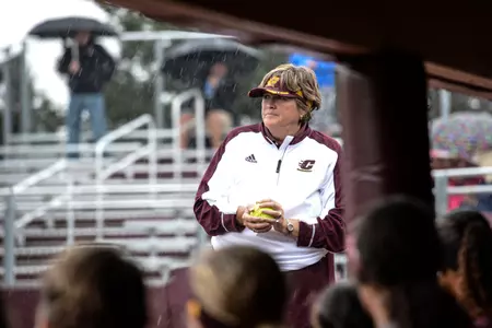 Margo Jonker waits out the rain during the Chippewas' exhibition game with Northwood last week at the stadium on campus named in her honor. Jonker is in her 37th season as CMU's coach.