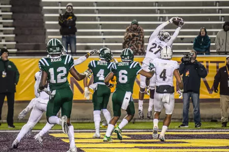 CMU defensive back Sean Buntin makes an interception in the end zone Tuesday to put the finishing touches on the Chippewas' 27-20 win over Ohio at Kelly/Shorts Stadium.
