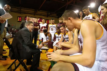 CMU coach Keno Davis (left) sends his team out against Green Bay in a nonleague game on Saturday.