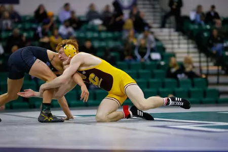 Central Michigan sophomore Justin Oliver (right) placed second at 149 pounds on Friday at the Midlands Championships.