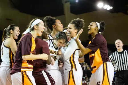 CMU sophomore Presley Hudson (center) is mobbed by her teammates Friday after the Chippewas' overtime win over Saint Joseph's at McGuirk Arena.