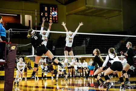 CMU's Kathia Sanchez (22) and Paige Carey go up to block Friday in a MAC match with Northern Illinois at McGuirk Arena.