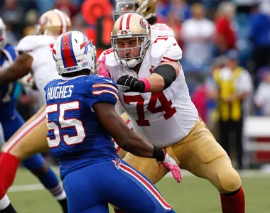 Oct 16, 2016; Orchard Park, NY, USA; San Francisco 49ers tackle Joe Staley (74) blocks Buffalo Bills defensive end Jerry Hughes (55) during the game at New Era Field. Mandatory Credit: Kevin Hoffman-USA TODAY Sport