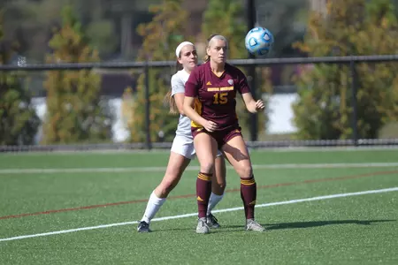 CMU's Madison Pogarch battles for position with a Buffalo player on Sunday during the teams' 0-0 tie at the CMU Soccer-Lacrosse Stadium.
