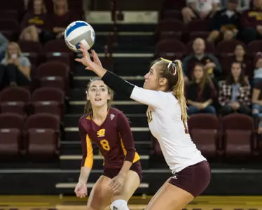 CMU freshman Hannah Warners (right) hits the ball toward the net as teammate Megan Kern looks on Friday during the Chippewas' loss to Buffalo at McGuirk Arena.