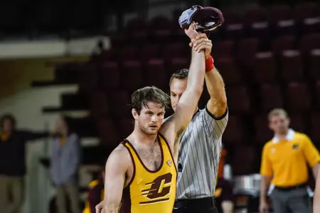 CMU senior Colin Heffernan, wrestling for the Maroon team, has his hand raised on Friday after winning by technical fall in the team's annual intrasquad dual at McGuirk Arena.