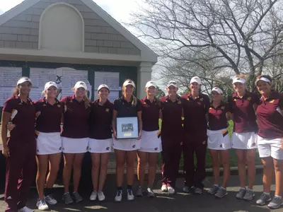 Members of the CMU golf team pose with their runner-up plaque on Tuesday at The Moors in Portage.