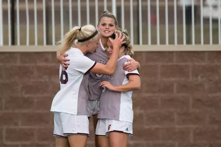 CMU junior Lexi Pelafas (center) celebrates a goal with two teammates on Thursday in the Chippewas' 5-0 win over Toledo.