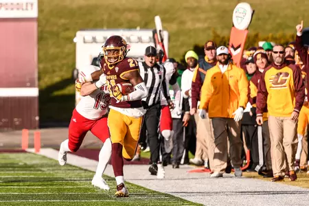 CMU senior Eric Cooper breaks a tackle en route to a 40-yard gain to set up the game-winning TD in the Chippewas' win on Friday at Kelly/Shorts Stadium.